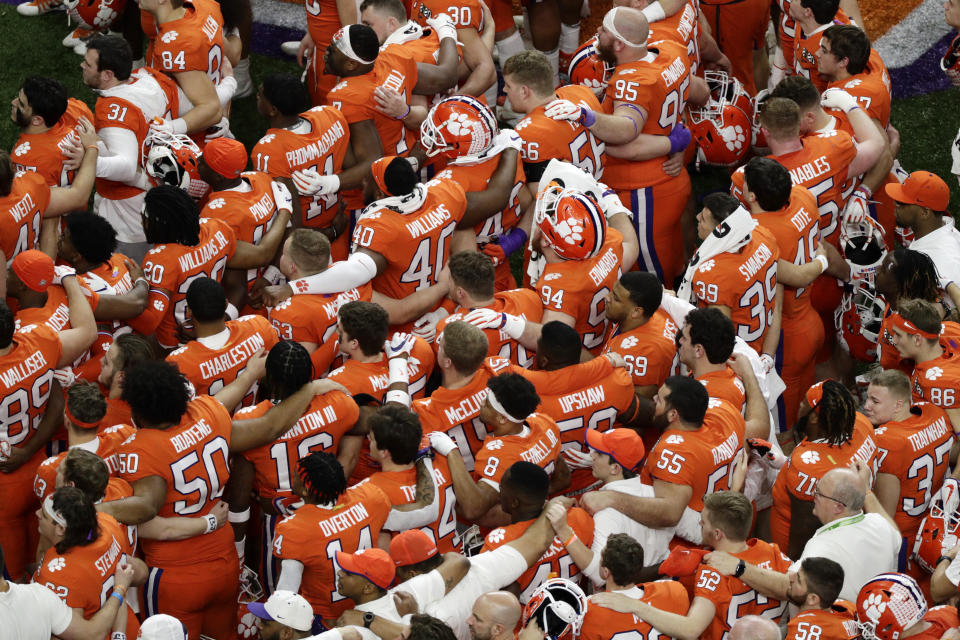 Clemson leaves the field after their loss against LSU in a NCAA College Football Playoff national championship game Monday, Jan. 13, 2020, in New Orleans. (AP Photo/Eric Gay)