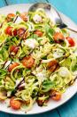 <p>Courgettes, tomatoes, mozzarella balls and basil. These ingredients make one hell of a tasty salad!</p><p>Get the <a href="https://www.delish.com/uk/cooking/recipes/a28839810/caprese-zoodles-recipe/" rel="nofollow noopener" target="_blank" data-ylk="slk:Caprese Zoodles;elm:context_link;itc:0;sec:content-canvas" class="link ">Caprese Zoodles</a> recipe.<br></p>