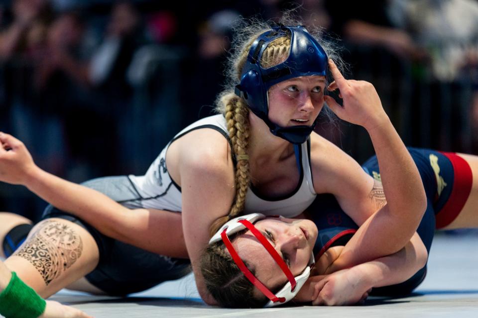 Copper Hills’s Kimberlynn Fowers and Herriman’s Hailey Harviecompete in the 6A Girls Wrestling State Championships at the UCCU Center in Orem on Thursday, Feb. 15, 2024. | Marielle Scott, Deseret News