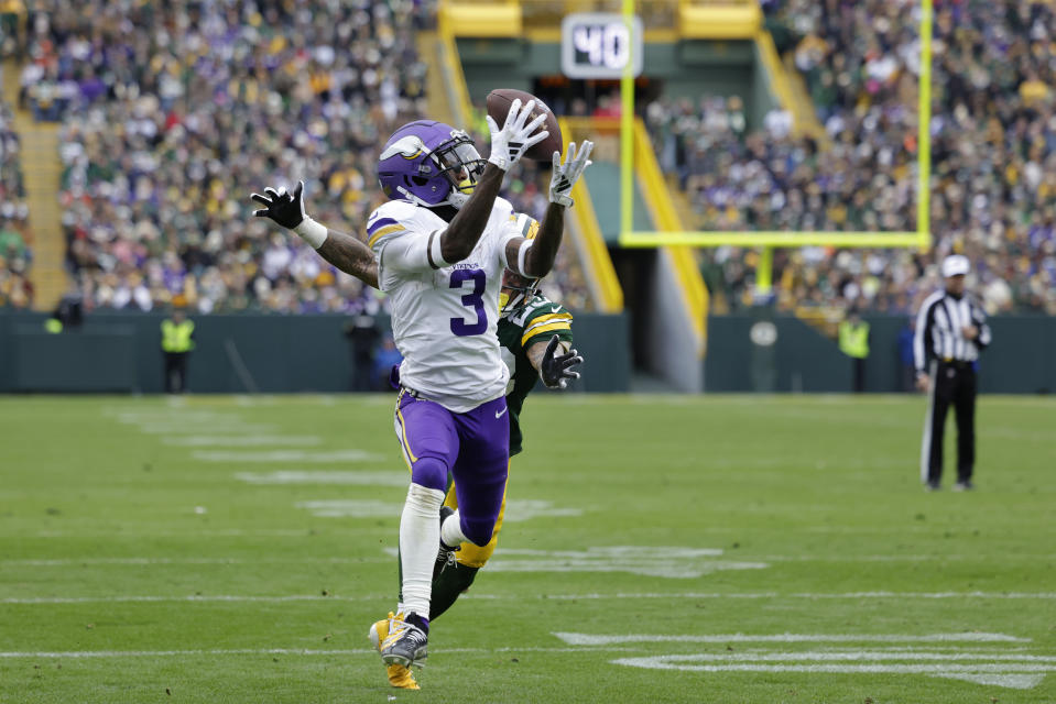 Minnesota Vikings wide receiver Jordan Addison (3) catches a pass against Green Bay Packers cornerback Jaire Alexander (23) to score a 20-yard touchdown during the second half of an NFL football game Sunday, Oct. 29, 2023, in Green Bay, Wis. (AP Photo/Matt Ludtke)