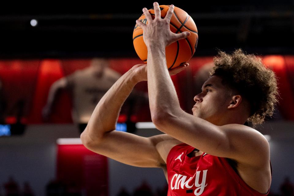 Guard Dan Skillings Jr. hits a 3-point basket in UC's 92-56 win over West Virginia Saturday. Skillings led the Bearcats with 17 points.