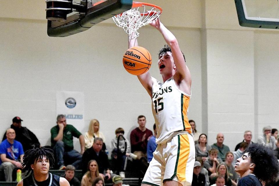 Cardinal Gibbons’ Cash McSweeney (15) slams home two points against Overhills in a NCHSAA 4A second round playoff game. Cardinal Gibbons and Overhills met in a NCHSAA 4A second round playoff game in Raleigh, N.C. on March 1, 2024.