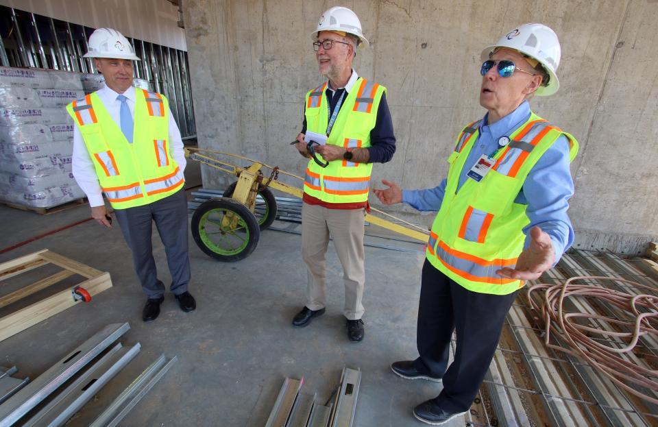 CaroMont President/CEO Chris Peek, Gazette writer Bill Poteat and Richard Blackburn take a tour as construction continued Wednesday, April 27, 2022, at the site of CaroMont Regional Medical Center-Belmont on Beatty Drive.