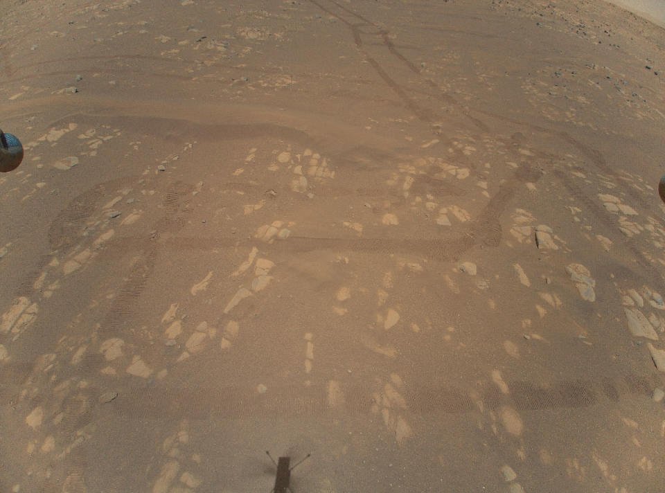 NASA has released the first-ever aerial, color images of Mars, which the Ingenuity helicopter snapped on a recent flight.