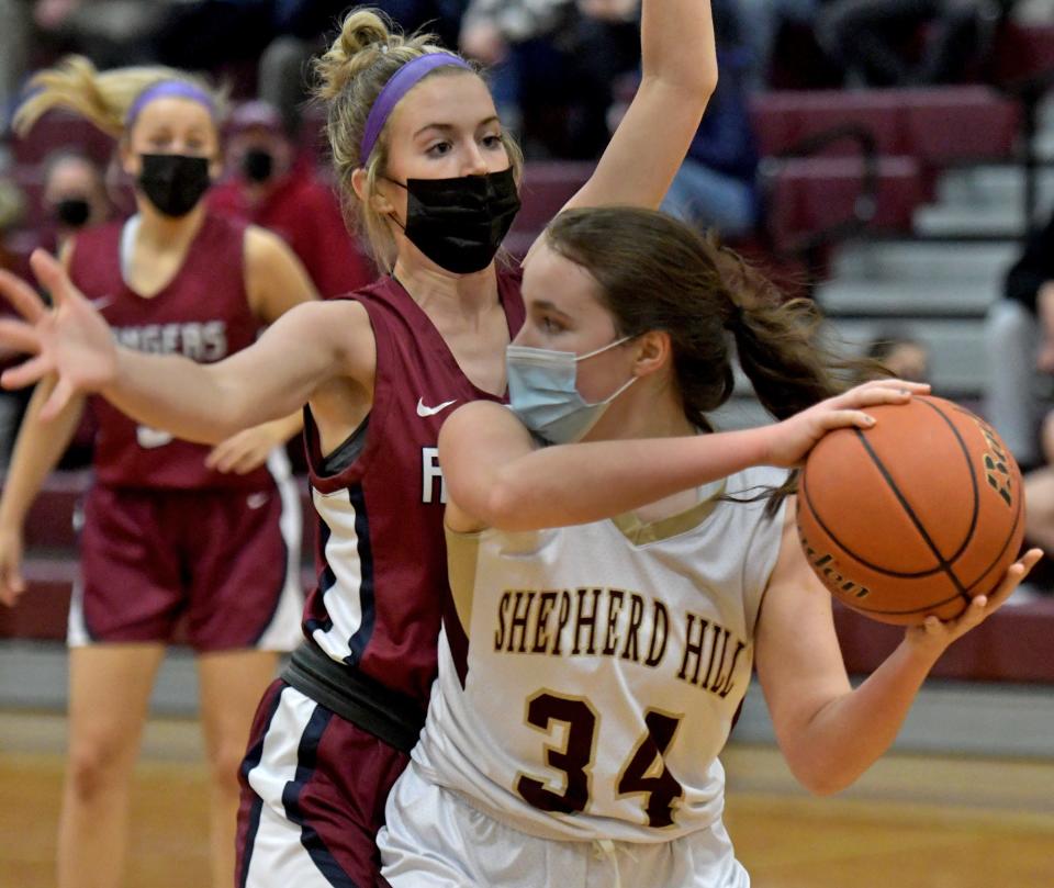 Shepherd Hill's Sydney FitzGerald gets hemmed in by Westboro's Kate Sams.