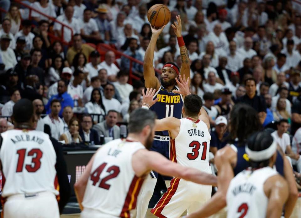 Denver Nuggets forward Bruce Brown (11) attempts a basket against the Miami Heat in the first half of Game 4 of the NBA Finals at the Kaseya Center in downtown Miami, Fla. on Friday, June 9, 2023.