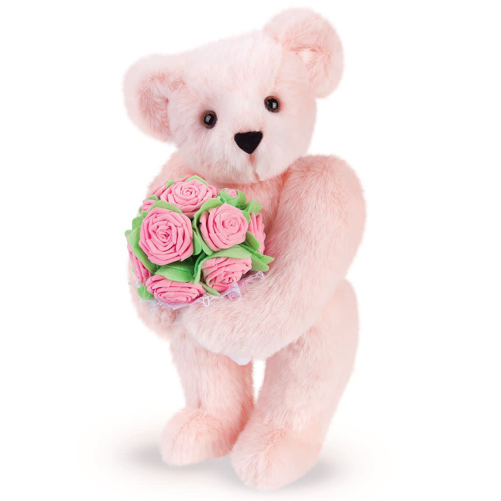 15" Teddy bear holding bouquet of pink roses