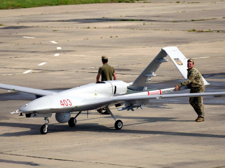 Ukrainian servicemen push a Bayraktar TB2 UCAV at the Kulbakyne aerodrome during the Exercise Sea Breeze 2021, Mykolaiv, southern Ukraine.