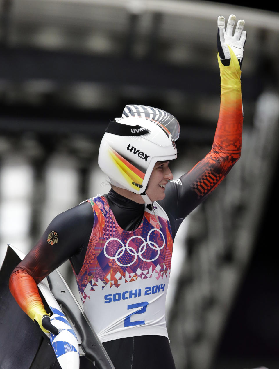 Natalie Geisenberger of Germany waves to supporters after finishing her second runduring the women's singles luge competition at the 2014 Winter Olympics, Monday, Feb. 10, 2014, in Krasnaya Polyana, Russia. (AP Photo/Dita Alangkara)