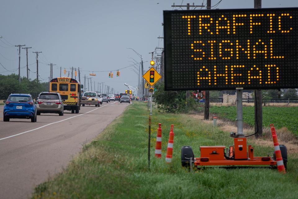 A sign warns drivers of a traffic light ahead on Farm-to-Market Road 43 at County Road 33 near London High School on Thursday, May 2, 2024, in Corpus Christi, Texas.
