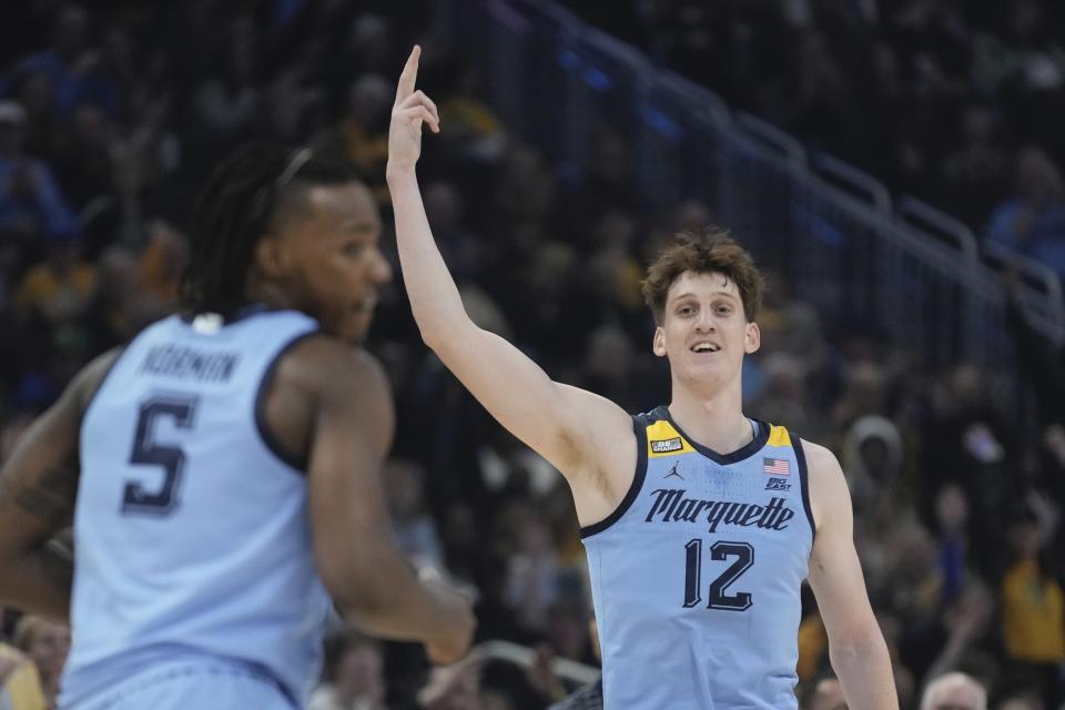 Marquette's Ben Gold reacts to his three pointer during the first half of an NCAA college basketball game Friday, Dec. 22, 2023, in Milwaukee. (AP Photo/Morry Gash)