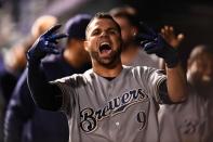 May 11, 2018; Denver, CO, USA; Milwaukee Brewers catcher Manny Pina (9) reacts to his game tying two run home run in the ninth inning against the Colorado Rockies at Coors Field. Mandatory Credit: Ron Chenoy-USA TODAY Sports