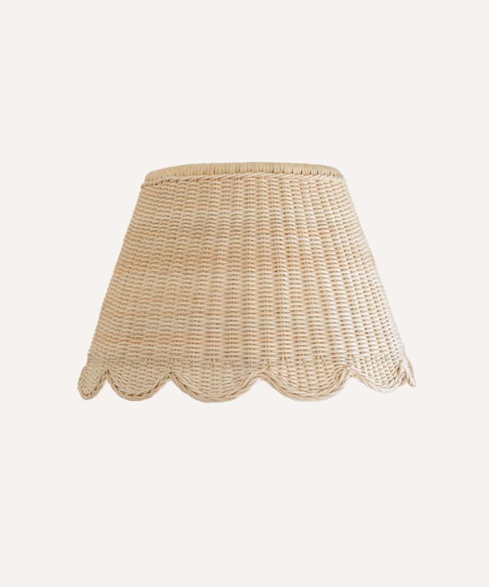 <p>A versatile rattan and cane lampshade, with a vintage silhouette and sweet scalloped edge. This piece is from one of our favourite new marketplaces, Glassette, and is ethically handwoven by talented artisans in Northern India.</p><p><strong>Shop now: <a href="https://glassette.com/products/185992-mimi-scalloped-lampshade-large" rel="nofollow noopener" target="_blank" data-ylk="slk:Mimi Scalloped Lampshade at Glassette;elm:context_link;itc:0;sec:content-canvas" class="link ">Mimi Scalloped Lampshade at Glassette</a></strong></p>