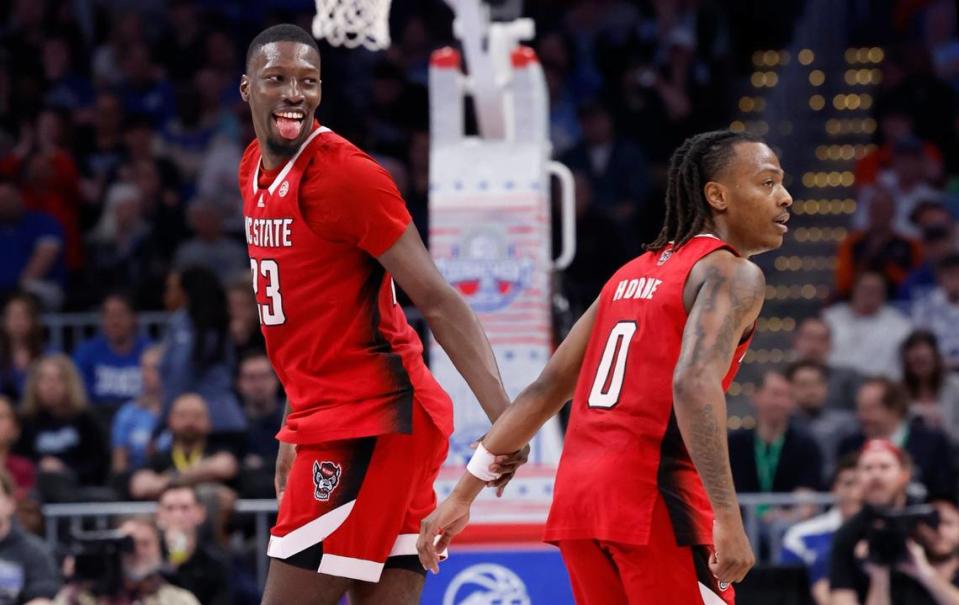 N.C. State’s Mohamed Diarra (23) celebrates with DJ Horne (0) after Diarra scored during the second half of N.C. State’s 74-69 victory over Duke in the quarterfinal round of the 2024 ACC Men’s Basketball Tournament at Capital One Arena in Washington, D.C., Thursday, March 14, 2024.
