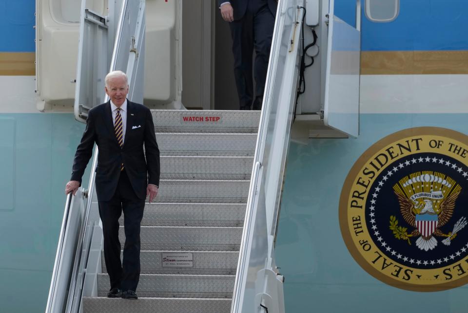 U.S. President Joe Biden smiles as he arrives on Air Force One for the the Association of Southeast Asian Nations (ASEAN) summit in Phnom Penh, Cambodia, Saturday, Nov. 12, 2022.