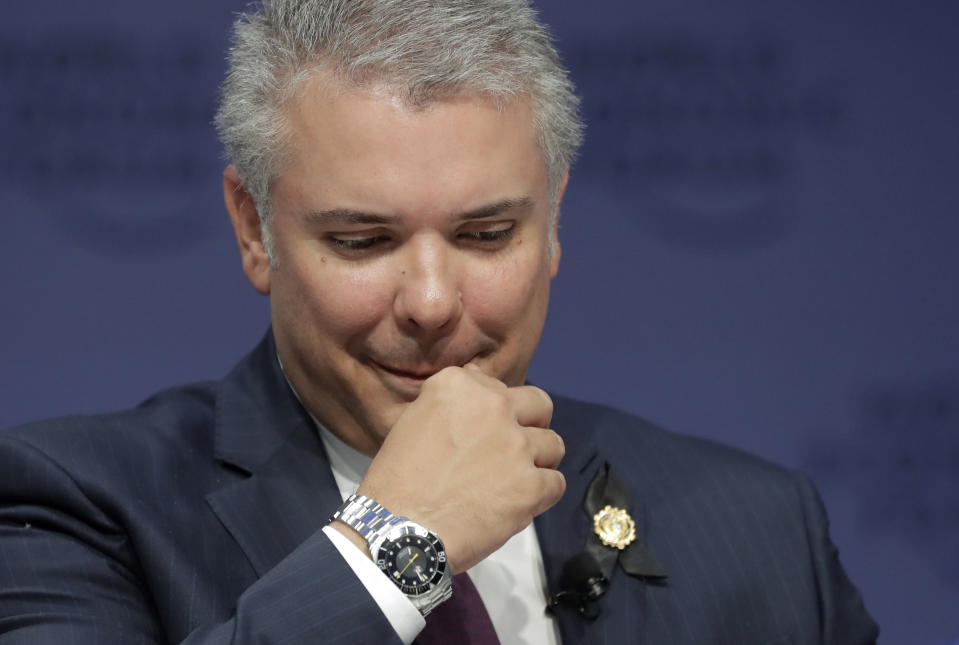 Colombia's President Ivan Duque participates in a session at the annual meeting of the World Economic Forum in Davos, Switzerland, Wednesday, Jan. 23, 2019. (AP Photo/Markus Schreiber)