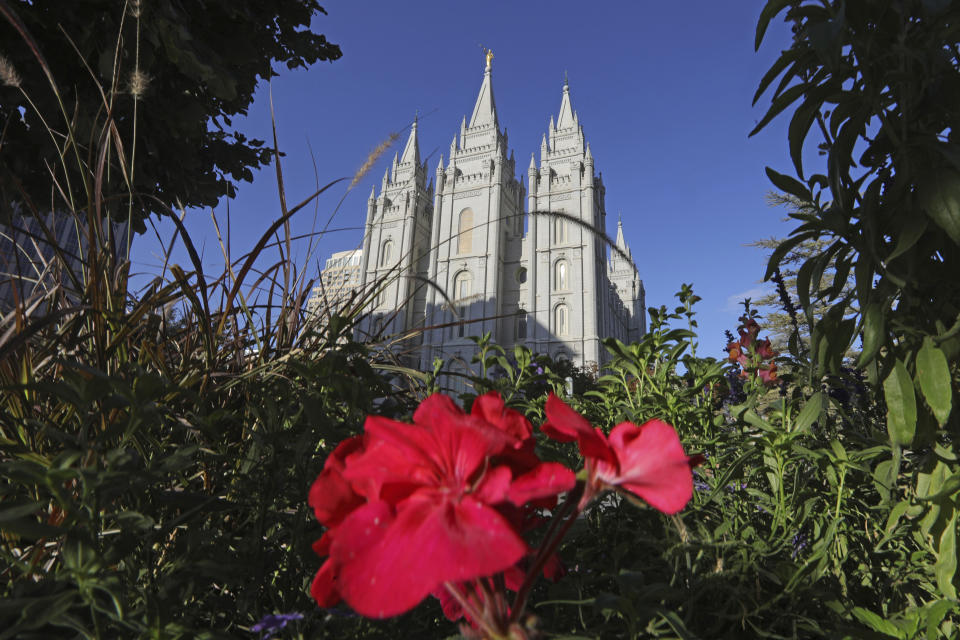 FILE - This Oct. 4, 2019, file photo, shows the Salt Lake Temple at Temple Square in Salt Lake City. The Church of Jesus of Christ of Latter-day Saints is opposing a proposed ban on conversion therapy in Utah, just months after it said it wouldn't stand in the way of a similar rule under consideration. The church said in a statement posted Tuesday night, Oct. 15, 2019, that the regulatory rule prohibiting Utah psychologists from engaging in LBGTQ conversion therapy with minors would fail to safeguard "religious beliefs" and doesn't account for "important realities of gender identity in the development of children." (AP Photo/Rick Bowmer, File)