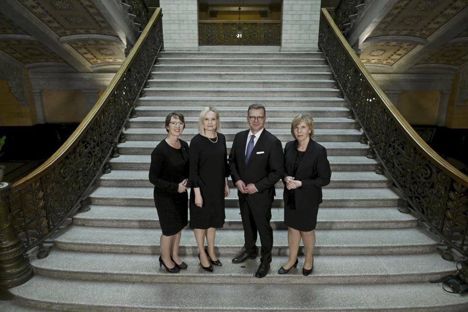 The new Government of Finland the right-wing coalition led by National Coalition Party chair Prime Minister Petteri Orpo, 2nd right, and Finns Party chair, Minister of Finance Riikka Purra, 2nd left, Swedish People's Party chair, Minister of Education Anna-Maja Henriksson, right, and Christian Democrats chair, Minister of Agriculture and Forestry Sari Essayah, left, pose for a family picture in Helsinki, Tuesday, June 20, 2023. (Antti Aimo-Koivisto/Lehtikuva via AP)