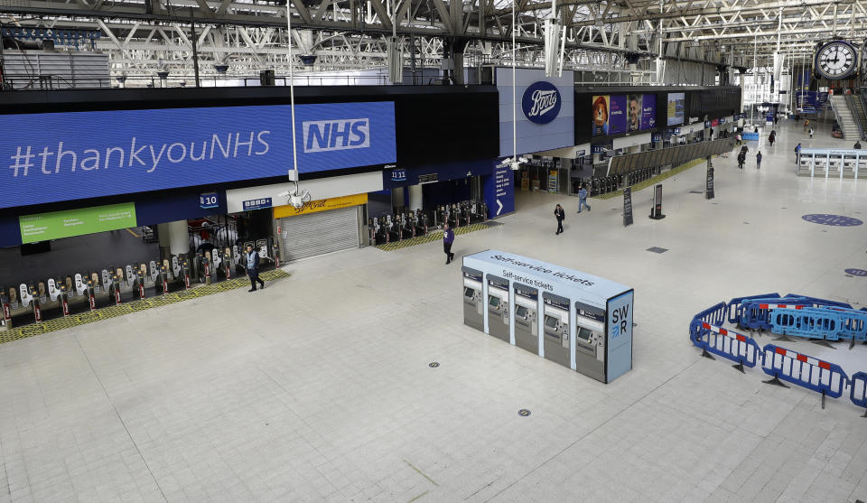 An almost empty Waterloo Station in London at 9am, Wednesday, May 13, 2020, as the country continues in lockdown to help stop the spread of coronavirus. Some of the coronavirus lockdown measures are being relaxed in England on Wednesday, with those workers who are unable to work from home, such as those in construction and manufacturing, encouraged to return to work. (AP Photo/Kirsty Wigglesworth)