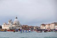 Scores of boats take to the Saint Mark's Basin, as Venetians protest against the damage caused by big ships, in Venice