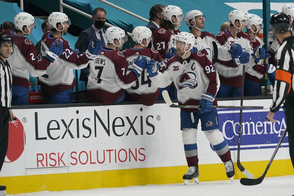 Colorado Avalanche left wing Gabriel Landeskog (92) celebrates with teammates after scoring against the San Jose Sharks during the second period of an NHL hockey game in San Jose, Calif., Monday, March 1, 2021. (AP Photo/Jeff Chiu)