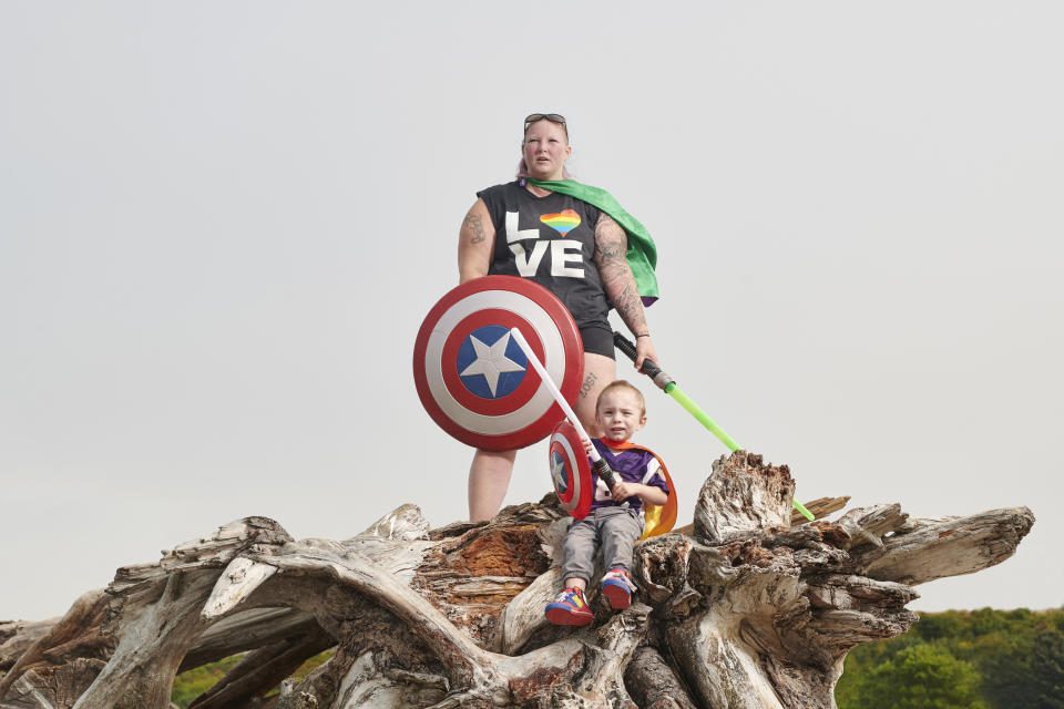 Erin Harrop is a researcher at the University of Washington who studies higher-weight woman with anorexia. She is pictured in the piece wearing a pride shirt alongside her son. &ldquo;I like that I&rsquo;m not hiding my stomach, thighs or arms,&rdquo; she said. &ldquo;Not because I&rsquo;m comfortable being photographed like that, but because I want to be &mdash; and I want others to feel free to be like that, too.&rdquo; (Photo: Finlay Mackay)