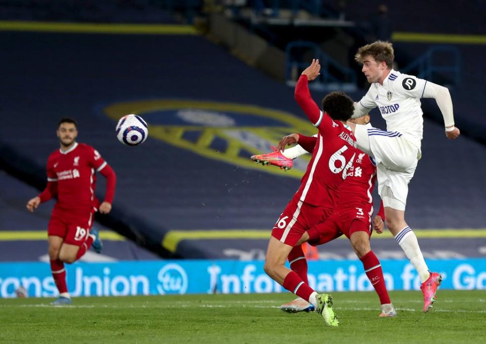 Patrick Bamford, right, has a shot at goal against Liverpool (Lee Smith/PA) (PA Wire)