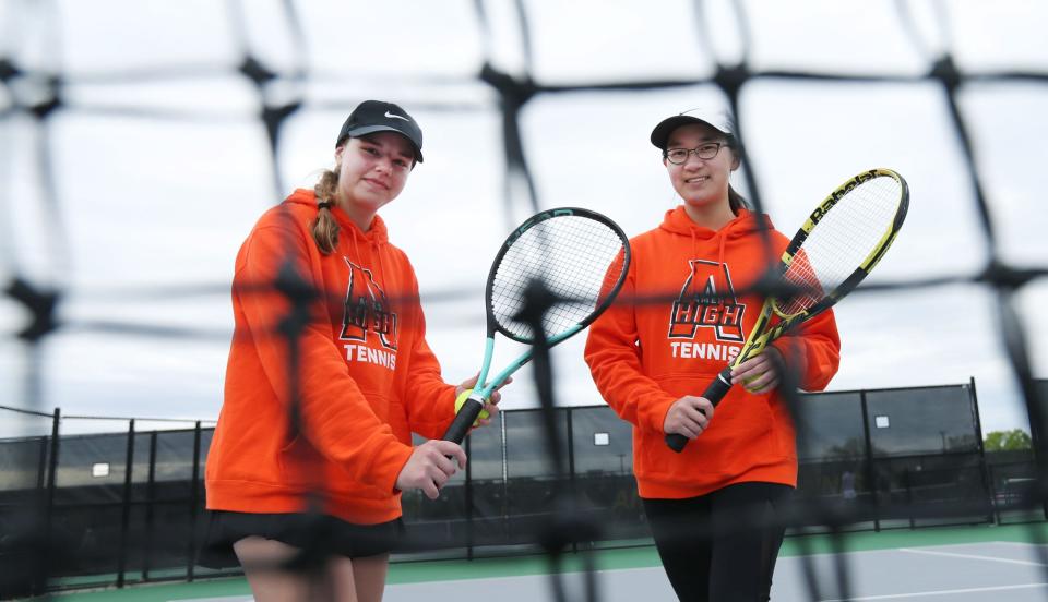 Ames girls tennis players Adeline Oetker (left) and Jiwen Li (right) are building confidence heading into the postseason. Li has become a valuable senior leader and Oetker has shown great potential during her sophomore season.