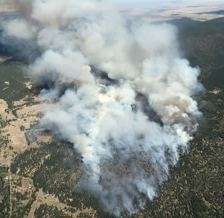 Smoke is seen from a fire in this aerial shot above Eagle Nest, New Mexico, U.S., May 31, 2018 in this picture obtained from social media on June 2, 2018. Justin Hawkins/via REUTERS