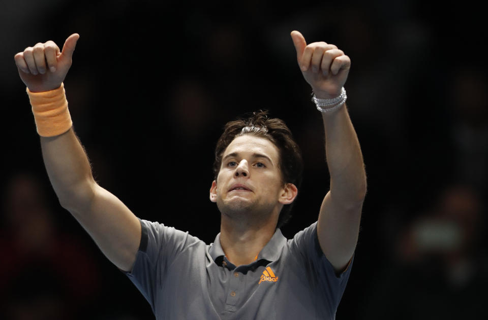 Austria's Dominic Thiem celebrates after defeating Serbia's Novak Djokovic in their ATP World Tour Finals singles tennis match at the O2 Arena in London, Tuesday, Nov. 12, 2019. (AP Photo/Alastair Grant)