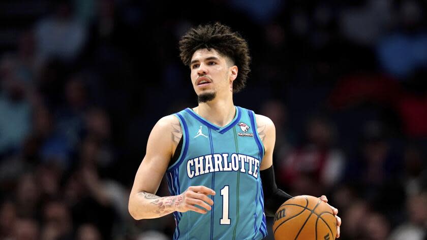 Charlotte Hornets guard LaMelo Ball (1) brings the ball up court against the Houston Rockets during the second half of an NBA basketball game Friday, Jan. 26, 2024 in Charlotte, N.C. (AP Photo/Jacob Kupferman)