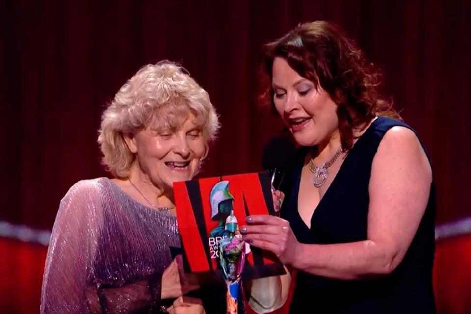 Jo Hamilton, left, helping to present a Brit Award to Raye (ITV)