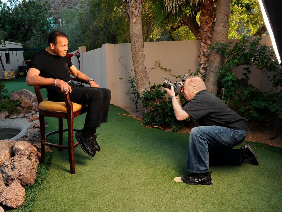 Boxing: Portrait of former heavyweight champion Muhammad Ali posing while getting his picture taken by photographer Neil Leifer during photo shoot at his home. Paradise Valley, AZ