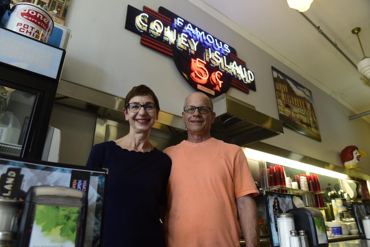 Jim and Cathy Smith stand behind the counter of their diner the last full week they operated it in June of 2022.