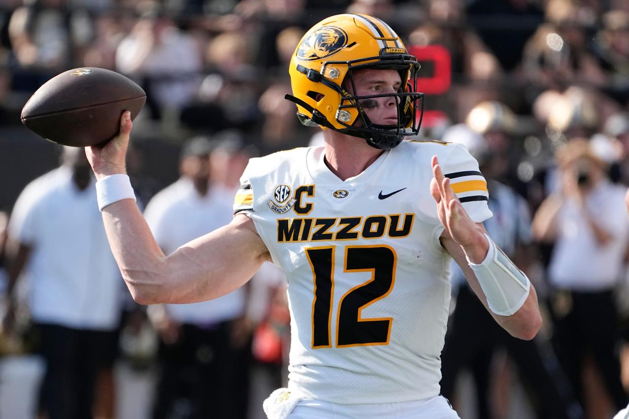 Missouri quarterback Brady Cook looks to throw a pass against Vanderbilt in the first half of an NCAA college football game Saturday, Sept. 30, 2023, in Nashville, Tenn. (AP Photo/George Walker IV)