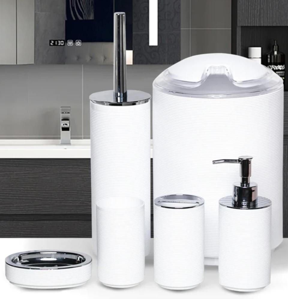 A white bathroom accessories set