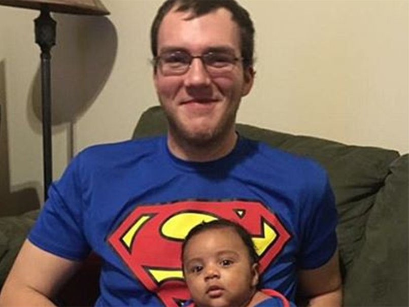 Church usher Robert Engle, in picture with unidentified baby, is being treated for a “significant” head injury he suffered in the scuffle (Facebook/Dave Visser)