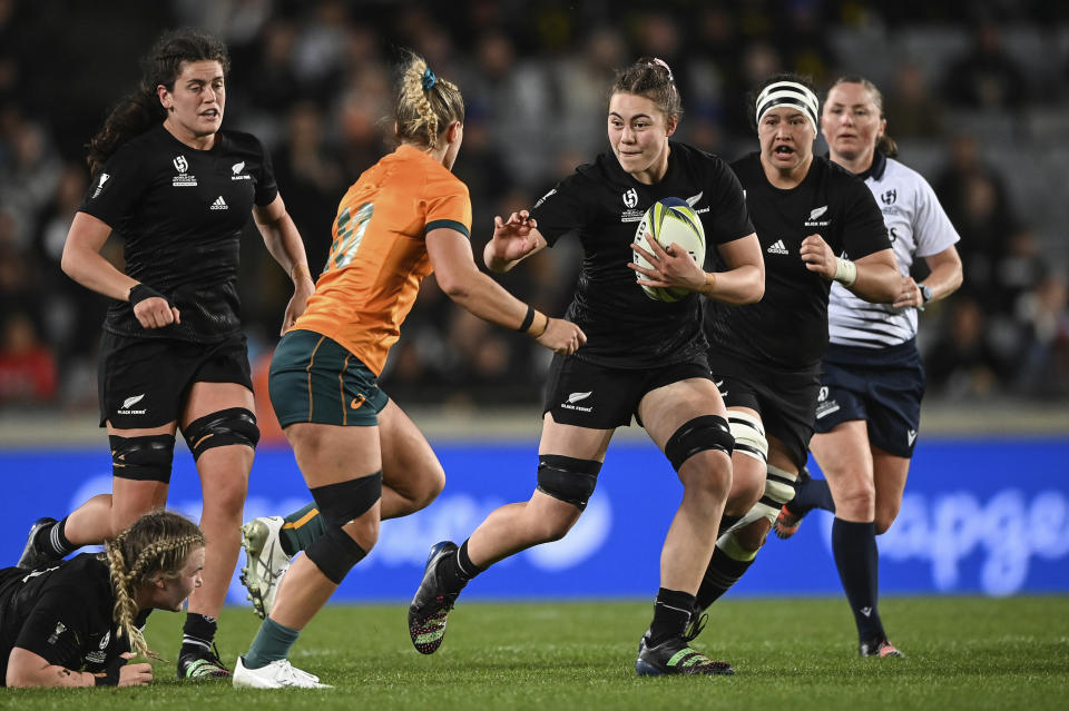 Maiakawanakaulani Roos of New Zealand runs at the defense during the Women's Rugby World Cup pool match between Australia and New Zealand, at Eden Park, Auckland, New Zealand, Saturday, Oct.8. 2022. (Andrew Cornaga/Photosport via AP)