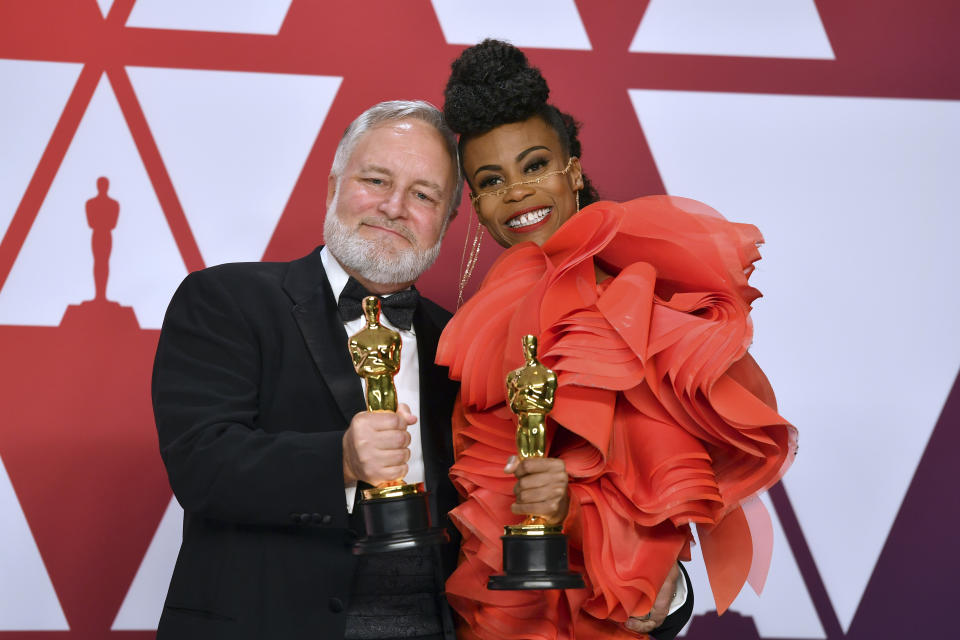 Jay Hart, left, and Hannah Beachler pose with the award for best production design for "Black Panther" in the press room at the Oscars on Sunday, Feb. 24, 2019, at the Dolby Theatre in Los Angeles. (Photo by Jordan Strauss/Invision/AP)