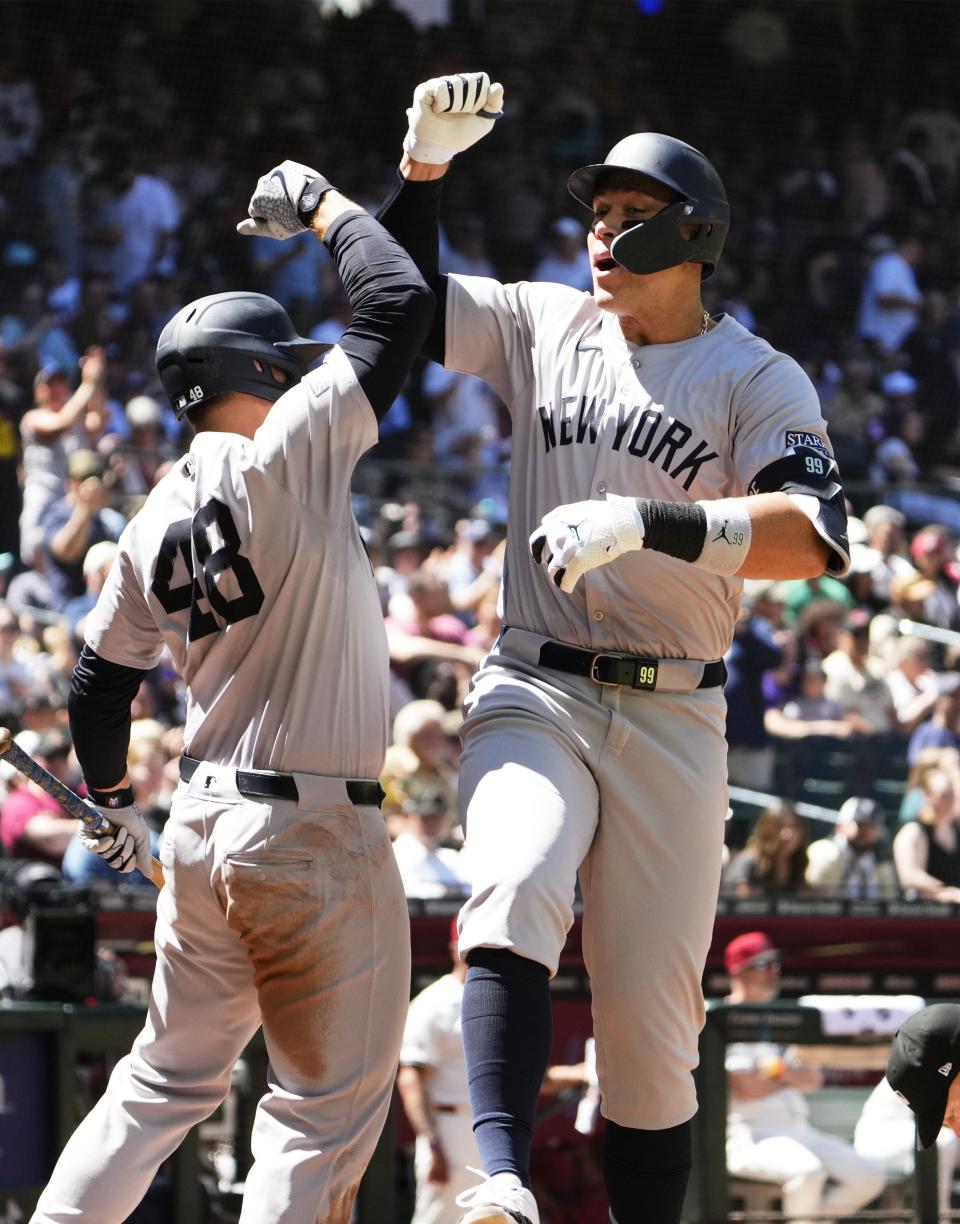 New York Yankees' Aaron Judge (99) reacts after hitting a two-run home run against the Arizona Diamondbacks in the fourth inning at Chase Field in Phoenix on April 3, 2024.