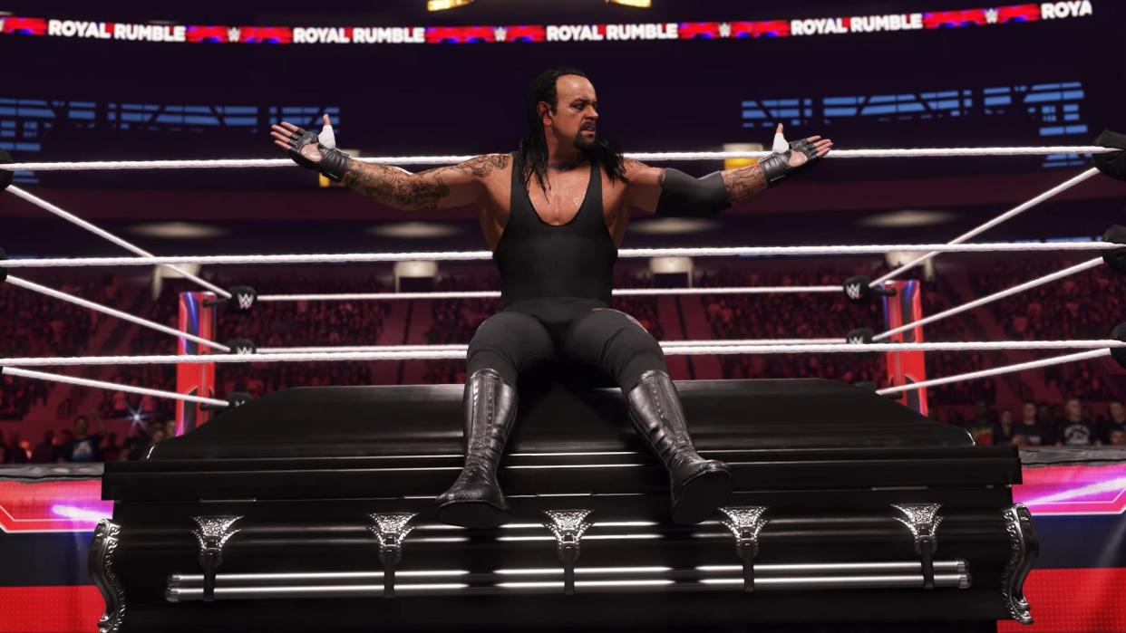  The Undertaker sits on a coffin. 