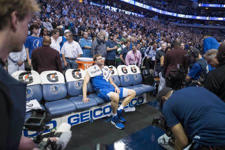 Apr 9, 2019; Dallas, TX, USA; Dallas Mavericks forward Dirk Nowitzki (41) sits by himself after a game against the Phoenix Suns at the American Airlines Center. Mandatory Credit: Jerome Miron-USA TODAY Sports