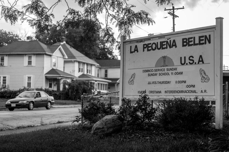 <p>Neighborhood residents attend a free Sunday breakfast and church service at La Requena Belen church in Middletown, Ohio. The service focuses on addiction — and the help that Christ can offer. (Photograph by Mary F. Calvert for Yahoo News) </p>