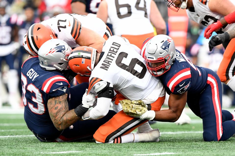 Nov 14, 2021; Foxborough, Massachusetts, USA; New England Patriots defensive end Lawrence Guy (93) and defensive end Deatrich Wise (91) sack Cleveland Browns quarterback Baker Mayfield (6) during the second half at Gillette Stadium.