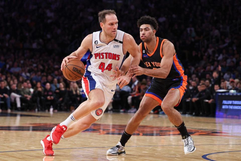 Pistons forward Bojan Bogdanovic dribbles against New York Knicks guard Quentin Grimes at Madison Square Garden, Nov. 11, 2022.