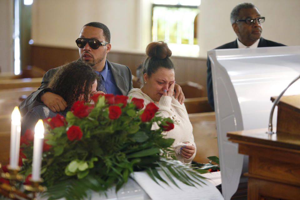 Friends and family mourn Derrick Fudge on Saturday, Aug. 10, 2019, at a church in Springfield, Ohio. Fudge, 57, was the oldest of nine who were killed when a gunman opened fire outside a bar early Sunday in Dayton, Ohio. (AP Photo/Angie Wang)