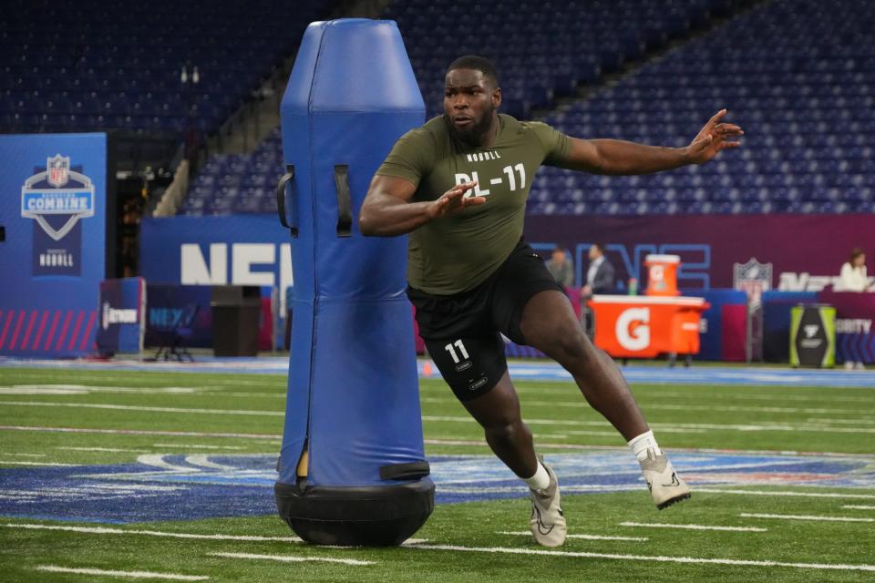 Texas defensive lineman Moro Ojomo competes in the NFL scouting combine in March. A relentless defensive tackle, Ojomo thrives against the run.