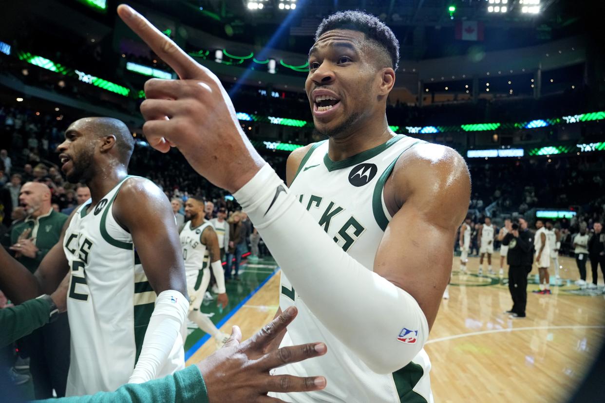 Milwaukee Bucks forward Giannis Antetokounmpo is unsuccessfully restrained by a staff member before he ran down the tunnel toward  the Indiana Pacers locker room after a game Dec. 13 because he wanted the game ball. Antetokounmpo scored a franchise record 64 points in the game.