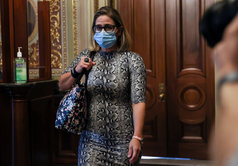 U.S. Senator Kyrsten Sinema departs meeting prior to delayed debt limit vote at the U.S. Capitol in Washington