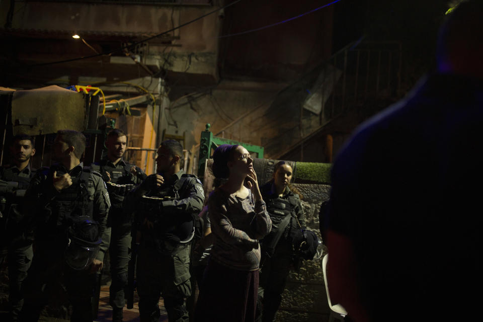 Israeli police stand guard in front of a Palestinian home occupied by settlers during a protest on the eve of a court verdict that may forcibly evict Palestinian families from their homes in the Sheikh Jarrah neighborhood of Jerusalem, Wednesday, May 5, 2021. Several Palestinian families in Sheikh Jarrah have been embroiled in a long-running legal battle with Israeli settler groups trying to acquire property in the neighborhood near Jerusalem's famed Old City. (AP Photo/Maya Alleruzzo)